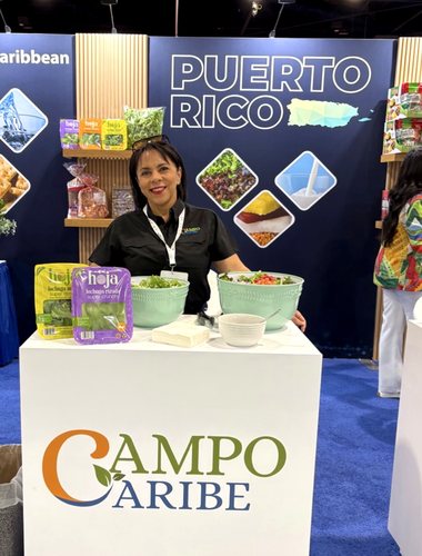 A Campo Caribe host at the branded counter in the Puerto Rico pavilion.